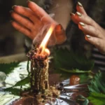 Return Lost Lover Spell ritual with a burning candle, spiritual energy work, and focused hands guiding the flame.